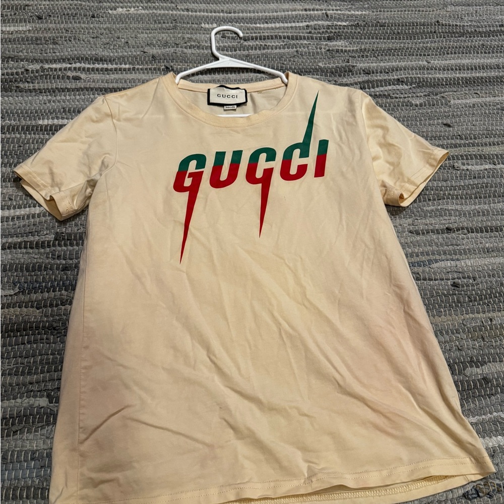 A Gucci shirt . Amazing feel and fit! Incredible deal! 

Runs XS/S sizing